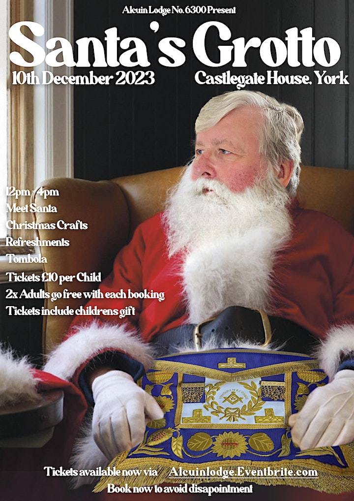 a man dressed as santa sits in an arm chair looking towards a window